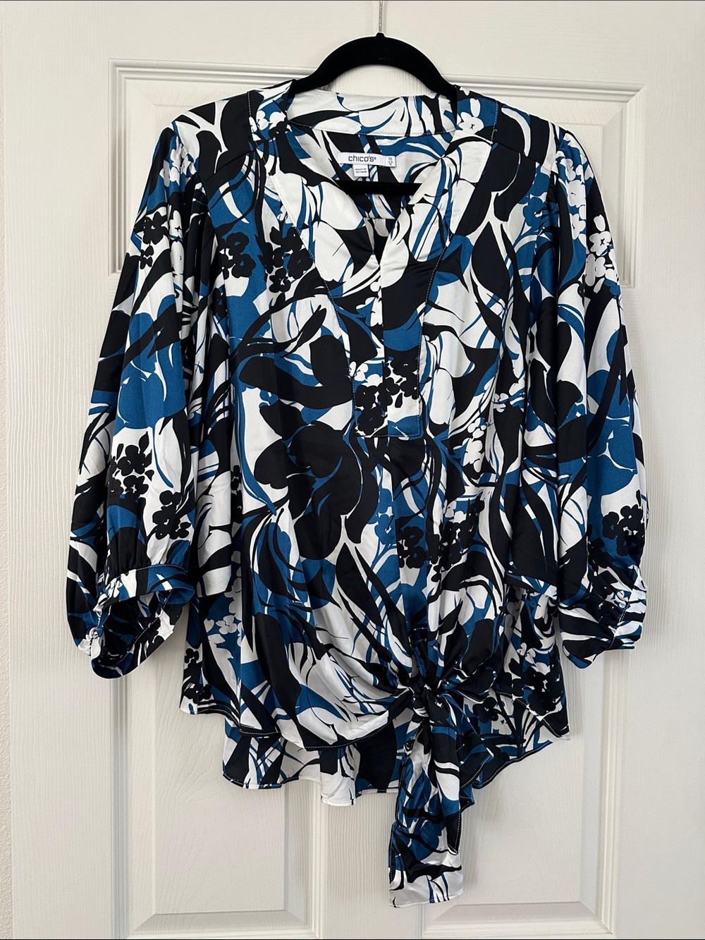 White blue and black floral blouse